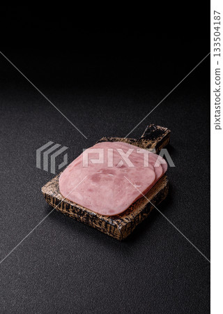 Meat, square ham sliced, organic food, protein for snacks. Sliced ham as a background 133504187