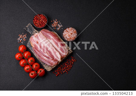 Meat, raw pork bacon sliced, organic food, protein for snacks. Raw bacon as a background Meat, raw pork bacon sliced, organic food, protein for snacks. Raw bacon as a background 133504213