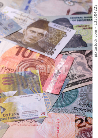 Paper money, banknotes of different countries as a business background. Paper money and cash Paper money, banknotes of different countries as a business background. Paper money and cash 133504225