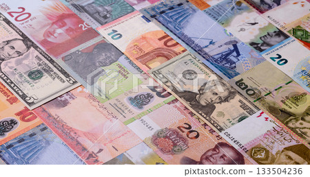 Paper money, banknotes of different countries as a business background. Paper money and cash Paper money, banknotes of different countries as a business background. Paper money and cash 133504236