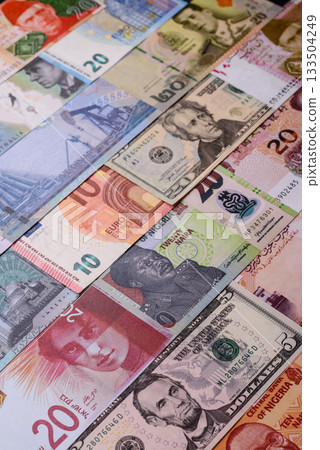 Paper money, banknotes of different countries as a business background. Paper money and cash Paper money, banknotes of different countries as a business background. Paper money and cash 133504249