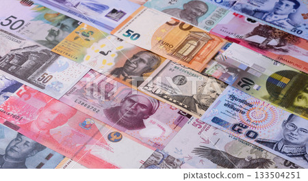 Paper money, banknotes of different countries as a business background. Paper money and cash Paper money, banknotes of different countries as a business background. Paper money and cash 133504251