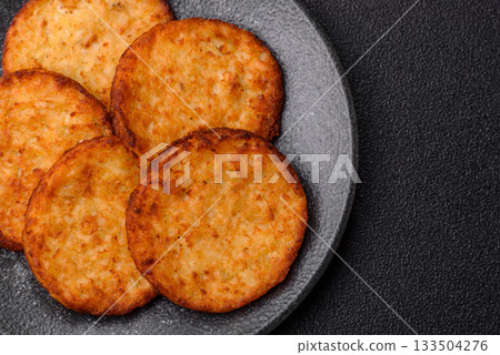 Potato hash browns, a cooked vegetable breakfast food. Potato hash brown 133504276