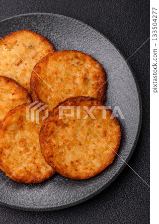 Potato hash browns, a cooked vegetable breakfast food. Potato hash brown Potato hash browns, a cooked vegetable breakfast food. Potato hash brown 133504277