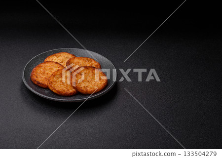 Potato hash browns, a cooked vegetable breakfast food. Potato hash brown 133504279