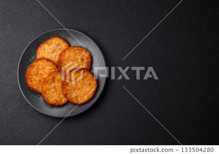 Potato hash browns, a cooked vegetable breakfast food. Potato hash brown Potato hash browns, a cooked vegetable breakfast food. Potato hash brown 133504280