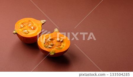 Half a raw pumpkin, a ripe orange colored butternut squash. Raw pumpkin Half a raw pumpkin, a ripe orange colored butternut squash. Raw pumpkin 133504285