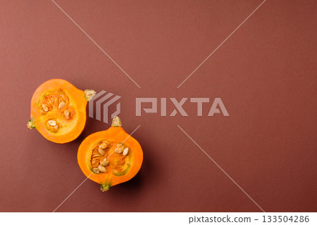 Half a raw pumpkin, a ripe orange colored butternut squash. Raw pumpkin Half a raw pumpkin, a ripe orange colored butternut squash. Raw pumpkin 133504286