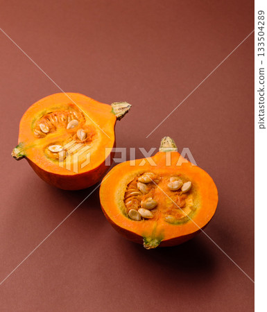Half a raw pumpkin, a ripe orange colored butternut squash. Raw pumpkin Half a raw pumpkin, a ripe orange colored butternut squash. Raw pumpkin 133504289