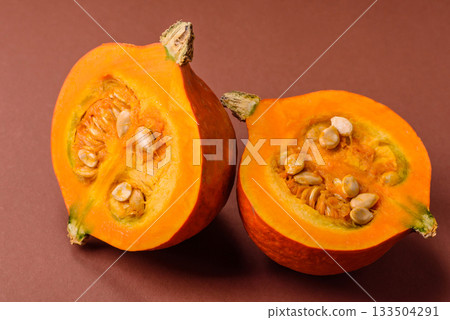 Half a raw pumpkin, a ripe orange colored butternut squash. Raw pumpkin Half a raw pumpkin, a ripe orange colored butternut squash. Raw pumpkin 133504291