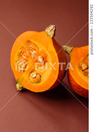 Half a raw pumpkin, a ripe orange colored butternut squash. Raw pumpkin Half a raw pumpkin, a ripe orange colored butternut squash. Raw pumpkin 133504292