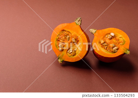Half a raw pumpkin, a ripe orange colored butternut squash. Raw pumpkin Half a raw pumpkin, a ripe orange colored butternut squash. Raw pumpkin 133504293