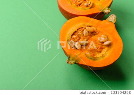 Half a raw pumpkin, a ripe orange colored butternut squash. Raw pumpkin Half a raw pumpkin, a ripe orange colored butternut squash. Raw pumpkin 133504298