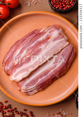 Meat, raw pork bacon sliced, organic food, protein for snacks. Raw bacon as a background Meat, raw pork bacon sliced, organic food, protein for snacks. Raw bacon as a background 133504317