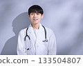 Portrait of a young man in a white coat Portrait of a young man in a white coat 133504807