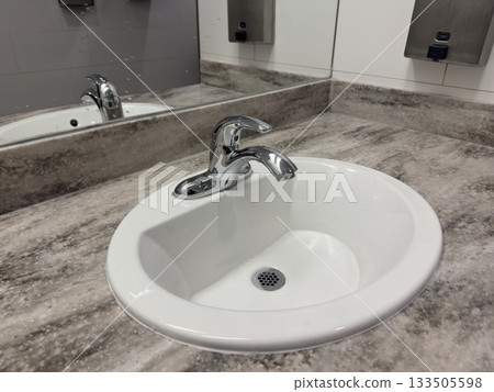 Clean modern restroom sink counter 133505598