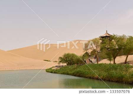 Crescent Moon Lake is an Oasis in the Gobi Desert at Dunhuang in China Crescent Moon Lake is an Oasis in the Gobi Desert at Dunhuang in China 133507076