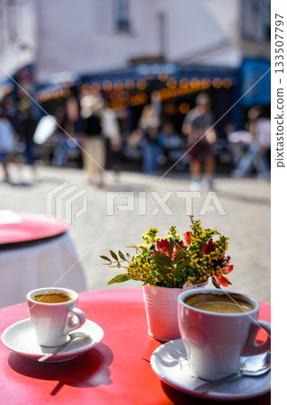 Coffee cups on red table in Paris street cafe Coffee cups on red table in Paris street cafe 133507797