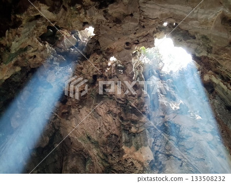 A shower of light shining into a cave, Marble Mountains, Vietnam 133508232