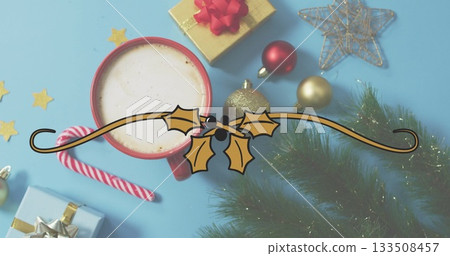 Red mug filled with foam resting on light blue surface, with candy cane, gifts, copy space Red mug filled with foam resting on light blue surface, with candy cane, gifts, copy space 133508457