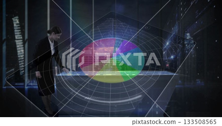 Examining businesswoman adjusting holographic pie chart on translucent table in office, copy space Examining businesswoman adjusting holographic pie chart on translucent table in office, copy space 133508565