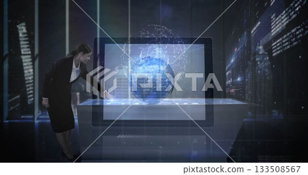 Interacting executive in suit operating touchscreen table at high-tech office, 3D globe, copy space 133508567