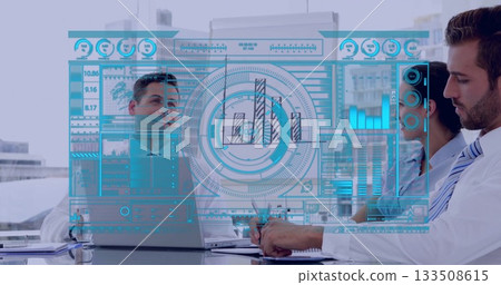 Floating holographic dashboard in office with suited coworkers, laptop, notebook and documents Floating holographic dashboard in office with suited coworkers, laptop, notebook and documents 133508615