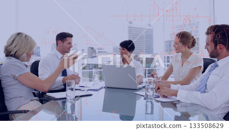 Debating professionals in business attire reviewing plan in conference room with laptop 133508629