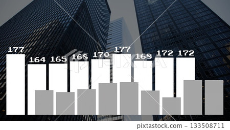 Displaying reflective glass towers ascending in business district, with frosted bar chart overlay 133508711