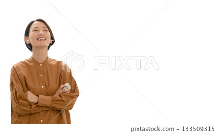 A woman listening to music or the radio (large) A woman listening to music or the radio (large) 133509315