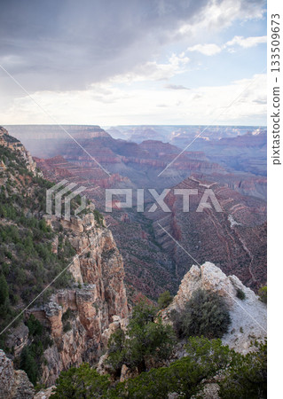 Vertical View Over Grand Canyon Cliff with Distant Landscape 133509673