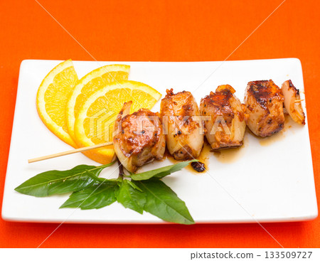 Grilled Calamari Skewers with Orange Slices Grilled Calamari Skewers with Orange Slices 133509727
