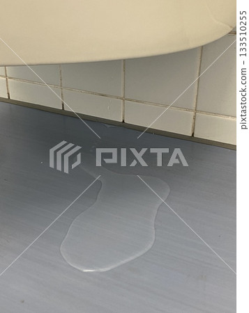 Leaking toilet urinal Leaking toilet urinal 133510255