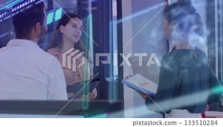 Four executives reviewing in glass office, with tablet clipboard laptop and data overlays Four executives reviewing in glass office, with tablet clipboard laptop and data overlays 133510284