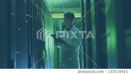 Korean technician in white lab coat inspecting server racks in data center, with tablet computer Korean technician in white lab coat inspecting server racks in data center, with tablet computer 133510425