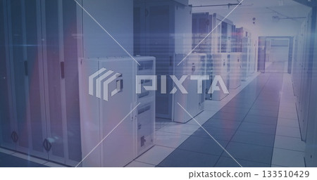 White server cabinets lining data center corridor, with overhead cable trays and raised floor tiles 133510429