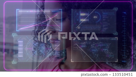 Analyzing data specialist woman using holographic panels in lab, with neon display reflection 133510451