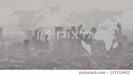 Showing skyscrapers rising above harbor cranes from roof with dot matrix world map, circular globe Showing skyscrapers rising above harbor cranes from roof with dot matrix world map, circular globe 133510482