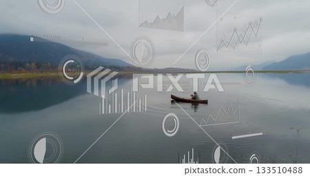 Paddling man in dark jacket and cap moving red canoe across mountain lake, with data overlays 133510488