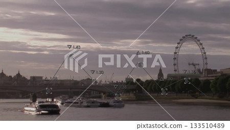 Gliding white-and-black passenger riverboat under stone bridge at dusk, with Ferris wheel 133510489