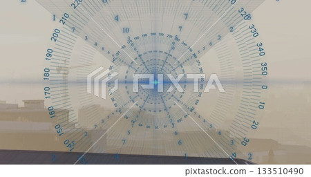 Displaying circular digital gauge with degree marks over rooftop skyline, with silhouetted friends 133510490