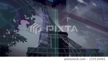 Displaying Eiffel Tower rising into cloudy Paris sky, with neon-green and purple data overlays 133510491