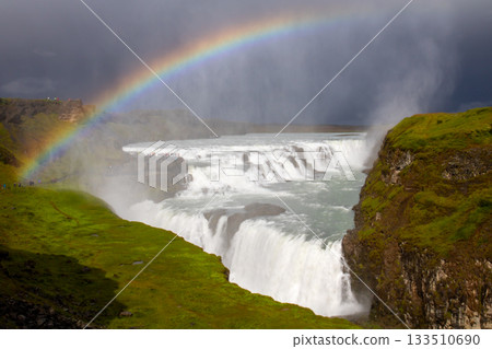 Gullfoss, the golden waterfall that flows from the Hvítaá River in the Nordic island nation of Iceland, and a rainbow 133510690