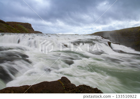 Gullfoss, meaning "golden waterfall," flows from the Hvítaá River in Iceland, a Nordic island nation. 133510922