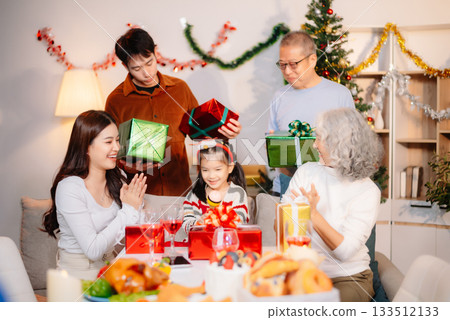 Capture the joy of Christmas with a cheerful family sharing smiles, gifts, and festive moments under a decorated tree Capture the joy of Christmas with a cheerful family sharing smiles, gifts, and festive moments under a decorated tree 133512133