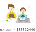 Woman cooking with boy 133512440