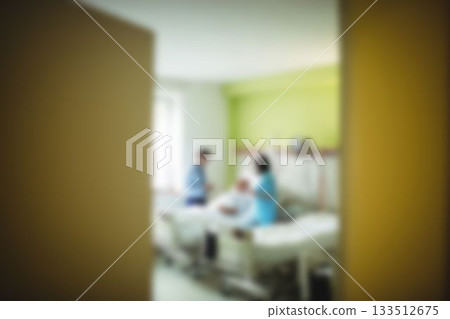 Doctor taking care of patient in hospital room 133512675