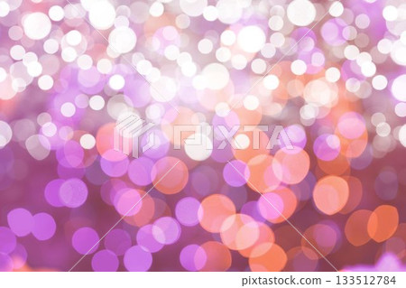 Abstract bokeh orbs are shimmering across flat illustration with purple, pink and orange gradients 133512784