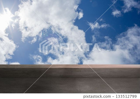 Flat design rooftop is showing concrete ledge under sky with white clouds and sunlight glare Flat design rooftop is showing concrete ledge under sky with white clouds and sunlight glare 133512799