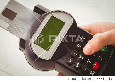 Man paying with credit card 133512915